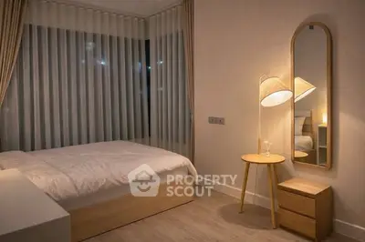 Cozy modern bedroom with stylish lighting and minimalist decor