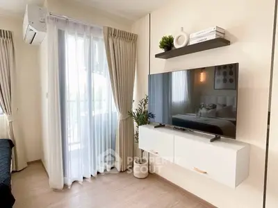 Modern living room with wall-mounted TV and balcony view
