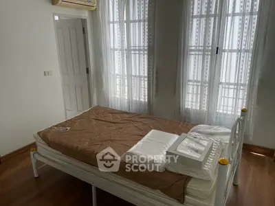 Cozy bedroom with natural light and simple decor