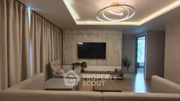 Modern living room with elegant lighting and cozy seating area