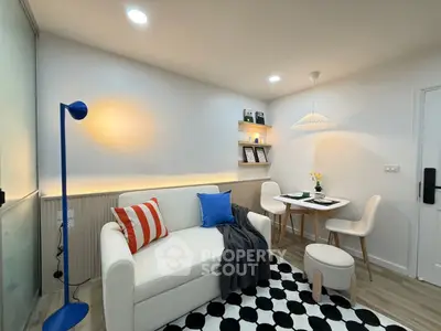 Modern living room with stylish decor and cozy dining area