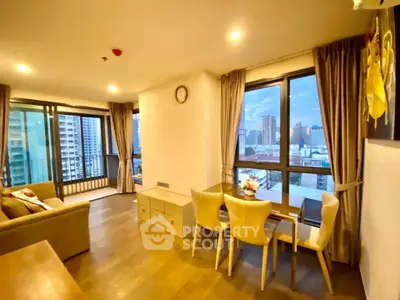 Spacious living room with city view and elegant dining area in modern apartment.