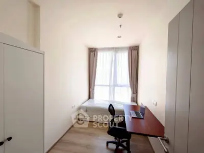 Cozy minimalist bedroom with study desk and natural light