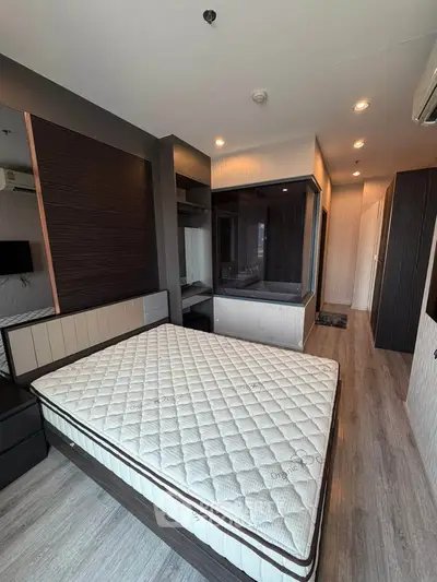 Modern bedroom with stylish decor and large window for natural light