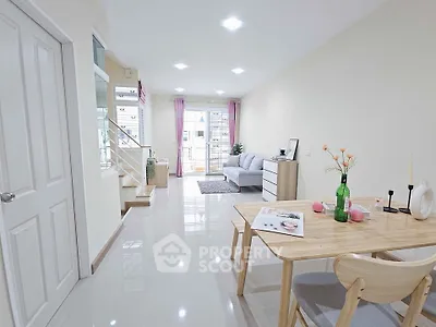 Bright and modern living room with dining area and balcony access