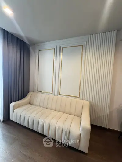 Elegant living room with stylish white sofa and modern paneling