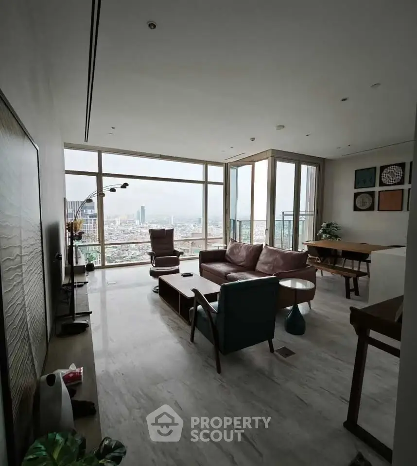 Spacious modern living room with panoramic city view and stylish furniture