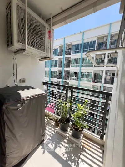 Charming balcony with potted plants and city view in modern apartment