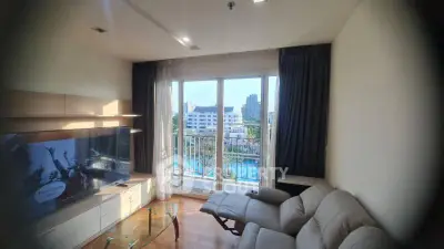 Modern living room with balcony view and stylish furniture in urban apartment