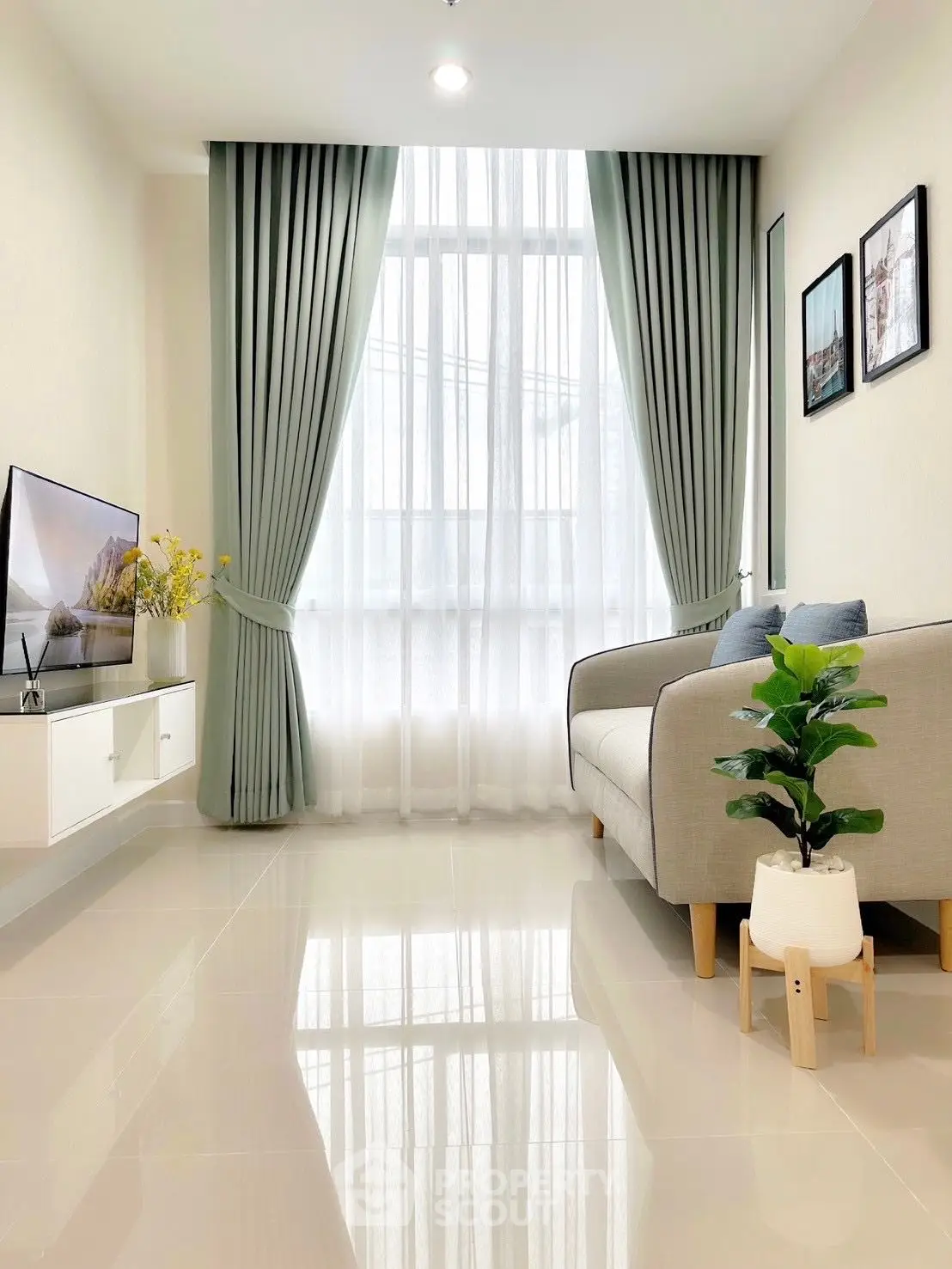 Bright and modern living room with large window and elegant decor
