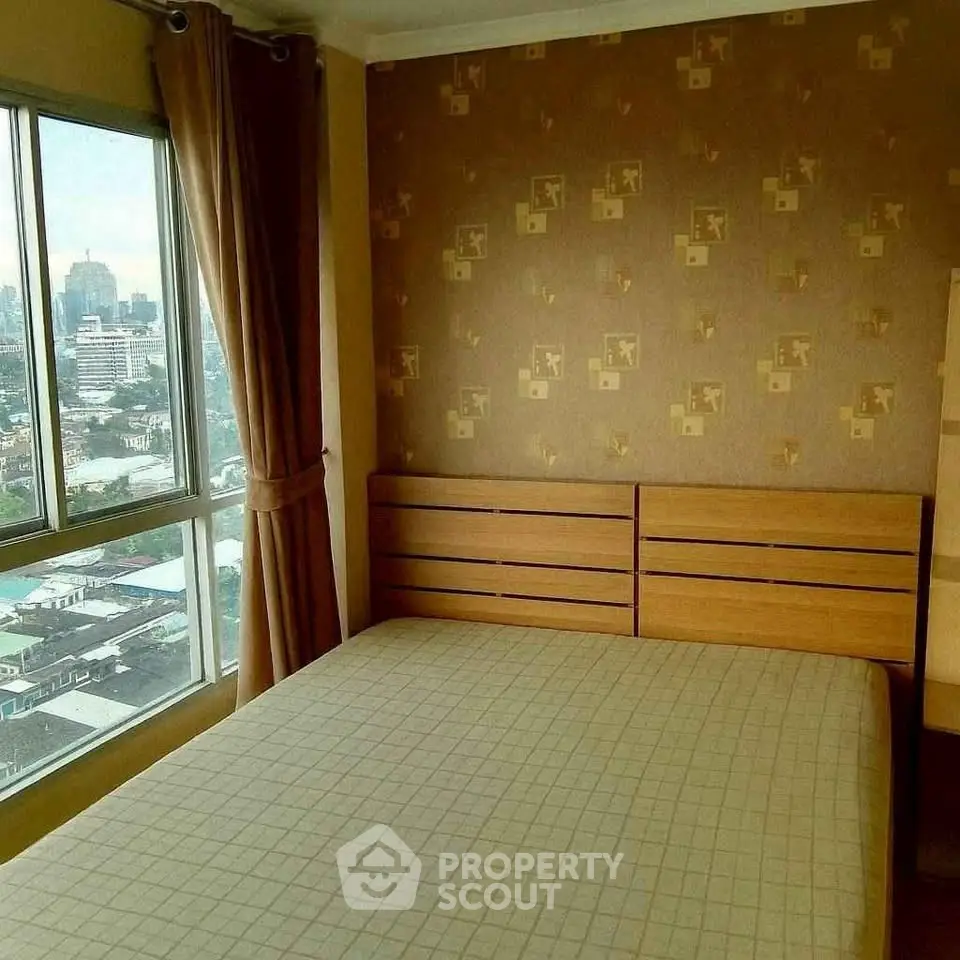 Cozy bedroom with city view and stylish wallpaper