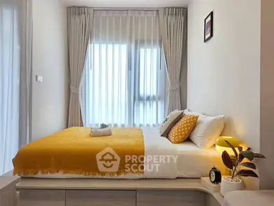 Cozy bedroom with modern decor and natural light, featuring a stylish bed and elegant curtains.