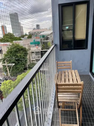 Charming urban balcony with wooden furniture and city view