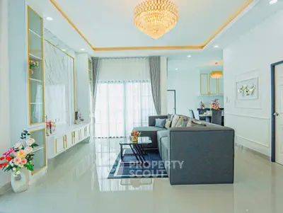 Luxurious modern living room with elegant chandelier and stylish decor