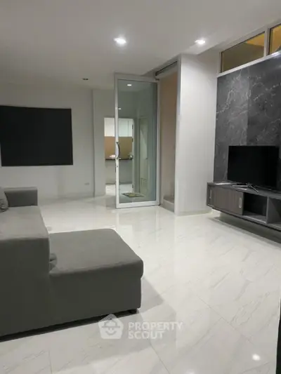 Modern living room with sleek marble flooring and stylish TV unit