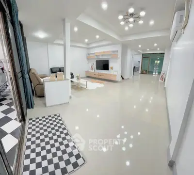 Spacious modern living room with sleek design and ample lighting