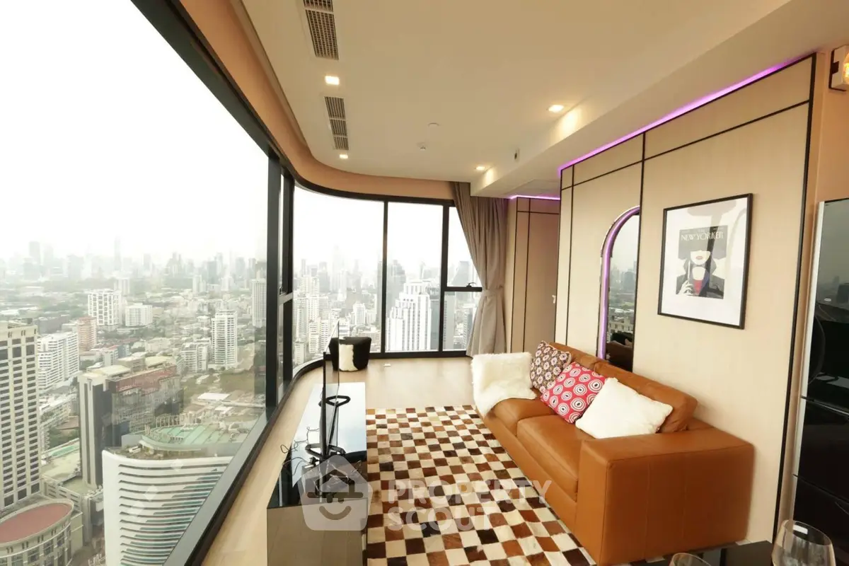 Luxurious high-rise living room with panoramic city views and modern decor.
