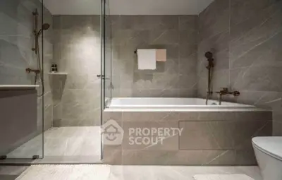 Luxurious modern bathroom with elegant bathtub and glass shower enclosure
