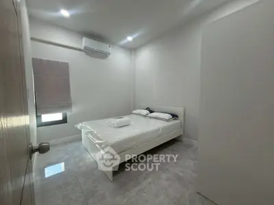 Modern minimalist bedroom with air conditioning and sleek design