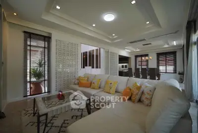 Luxurious living room with elegant decor and spacious seating area, perfect for relaxation and entertainment.