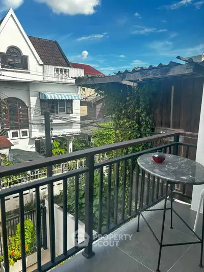 Charming balcony with city view, perfect for relaxation and enjoying the outdoors.
