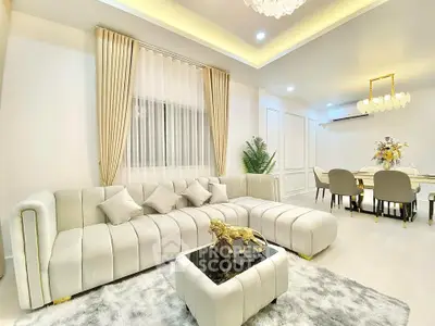 Luxurious living room with elegant decor and plush seating in a modern home.