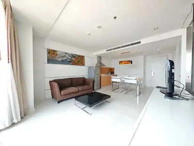 Modern open-plan living room with sleek kitchen and stylish decor
