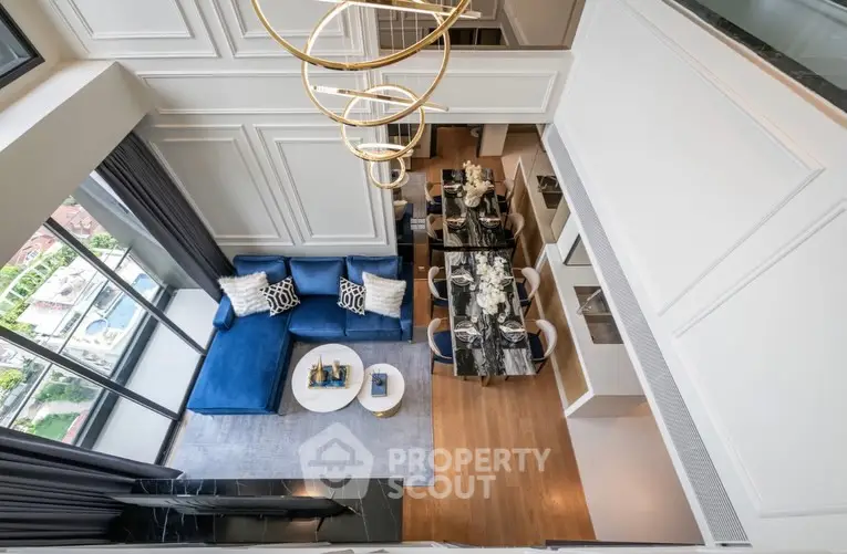 Luxurious modern living room with high ceiling and elegant decor