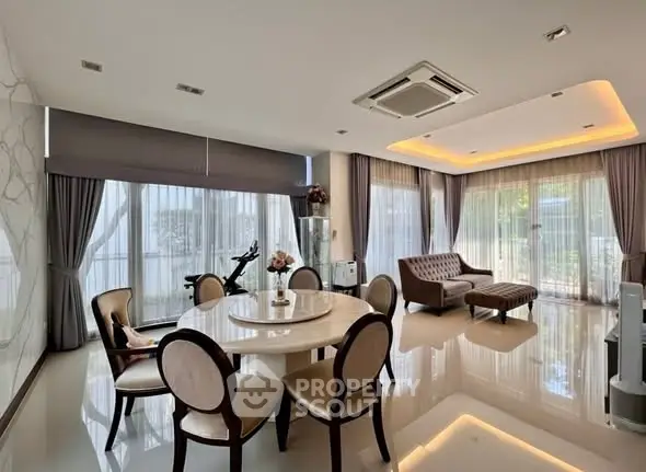 Luxurious living room with elegant dining area and modern decor