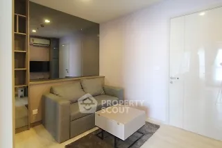 Modern living room with sleek sofa and stylish decor in a contemporary apartment.