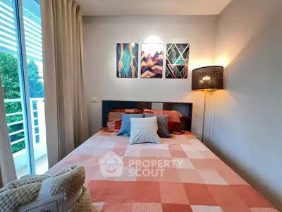 Cozy bedroom with modern decor and balcony view