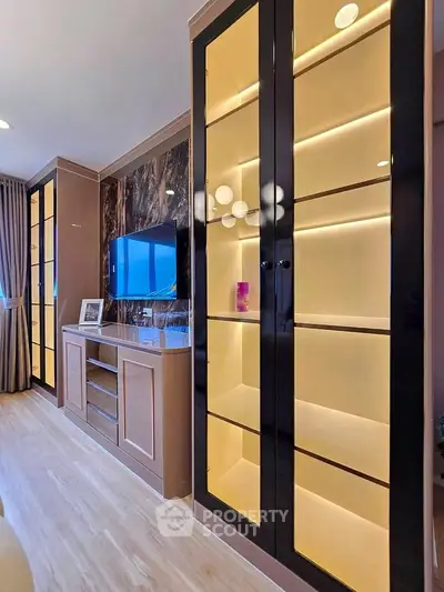 Luxurious living room with elegant built-in cabinets and modern TV setup