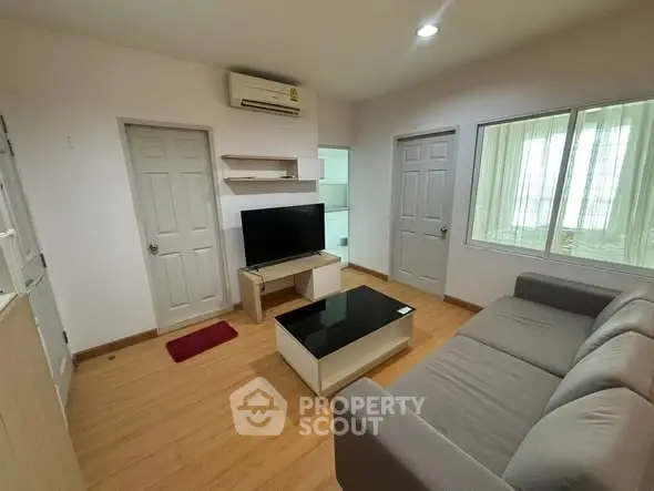 Cozy living room with modern furniture and wooden flooring