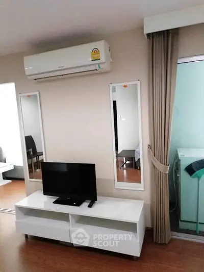 Modern living room with air conditioning and sleek furniture in a stylish apartment.