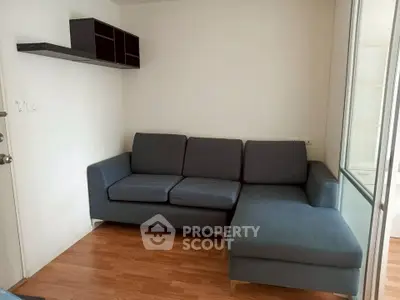 Cozy living room with modern L-shaped sofa and wooden flooring