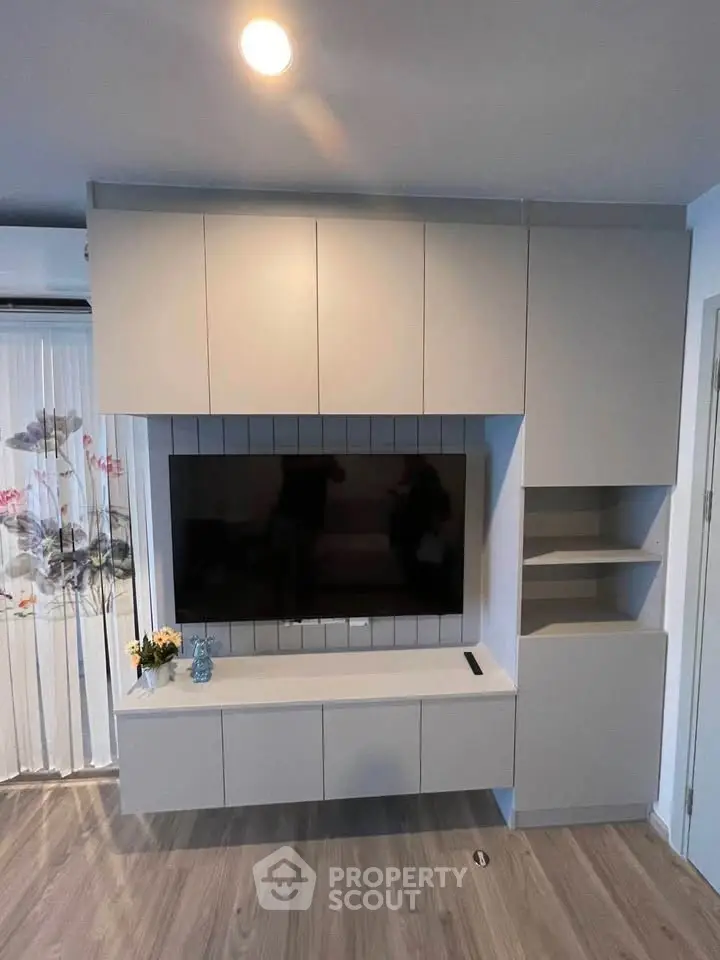 Modern living room with sleek built-in TV cabinet and stylish decor