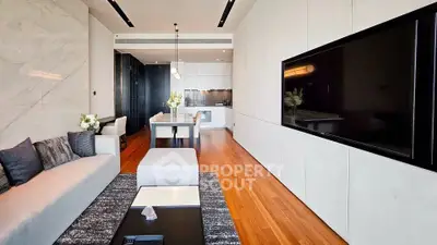 Luxurious modern living room with sleek design and open kitchen layout