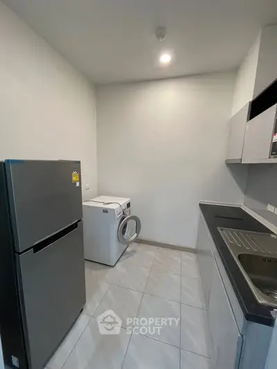 Modern kitchen with sleek appliances and ample storage space