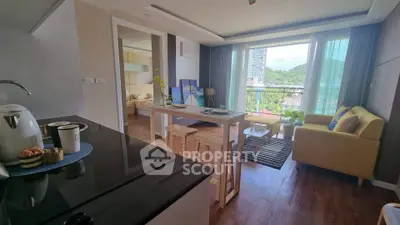 Modern open-plan living room with kitchen and balcony view in a stylish apartment