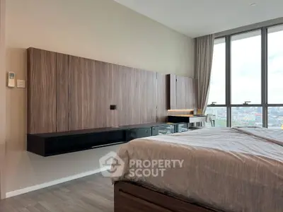 Modern bedroom with panoramic city view and sleek wooden furnishings.