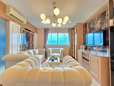 Luxurious living room with elegant white sofas and modern chandelier