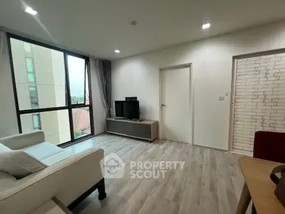Modern living room with large windows and stylish decor