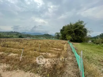 Expansive rural land with scenic mountain views, perfect for agricultural development or serene countryside living.