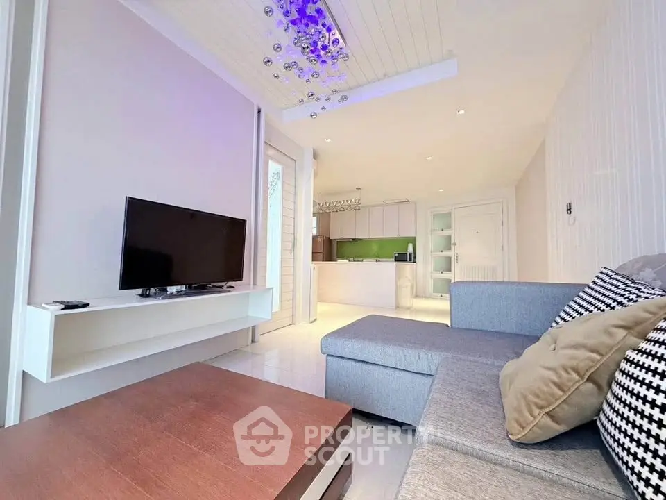 Modern living room with stylish decor and open kitchen layout