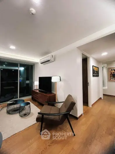 Modern living room with stylish furniture and wooden flooring