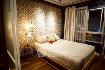 Chic bedroom with stylish wallpaper and cozy lighting for a modern living experience.