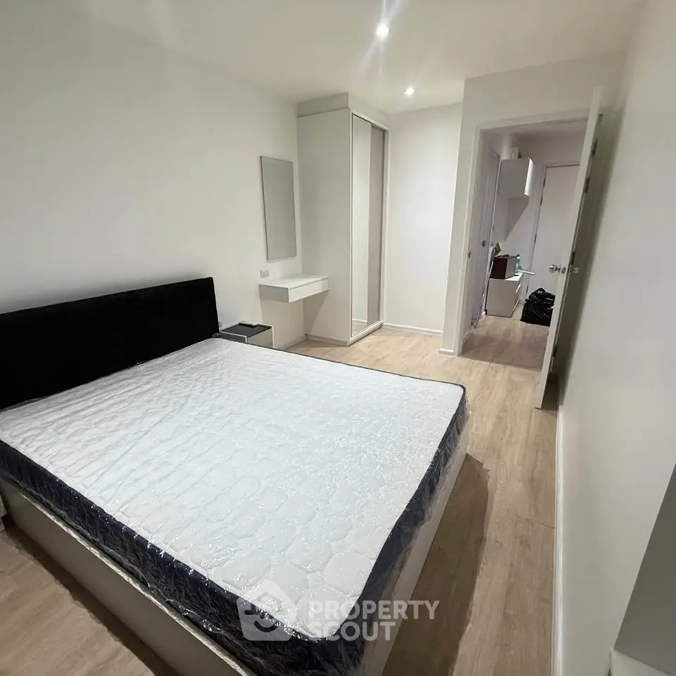 Spacious bedroom with modern design and ample natural light