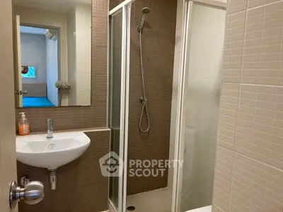 Modern bathroom with glass shower and sleek sink design