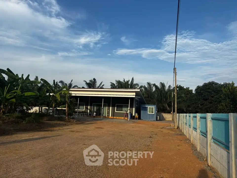 Charming rural home with spacious yard and lush greenery, perfect for tranquil living.