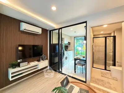 Modern living room with open kitchen and stylish decor